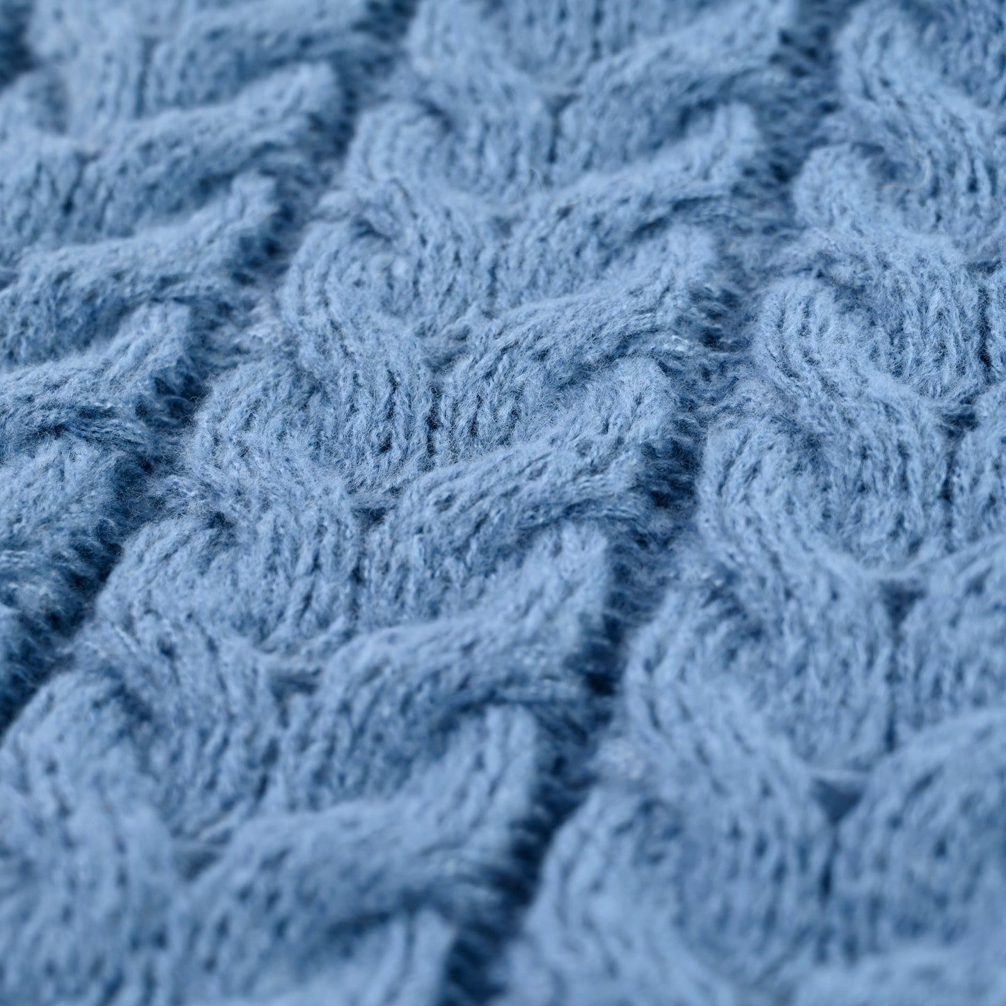 Roll neck cable knit jumper in blue