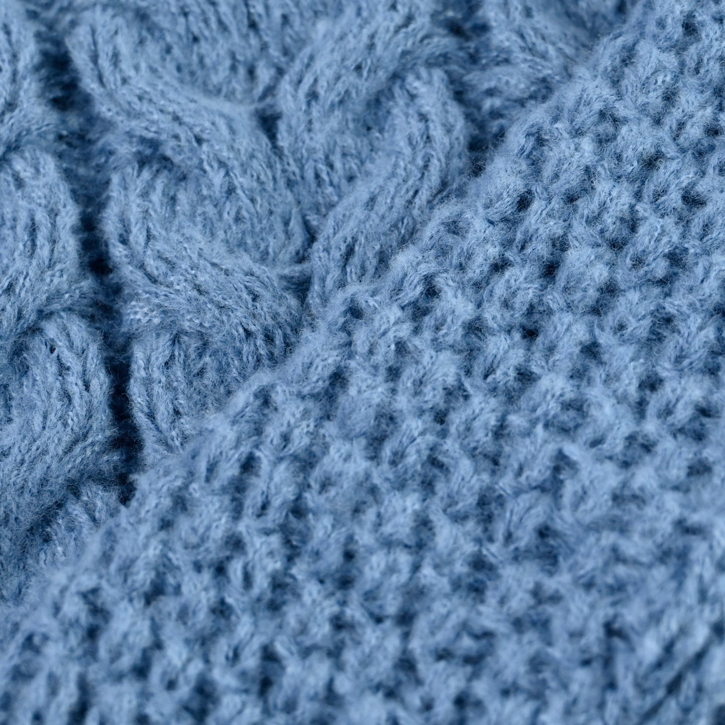 Roll neck cable knit jumper in blue