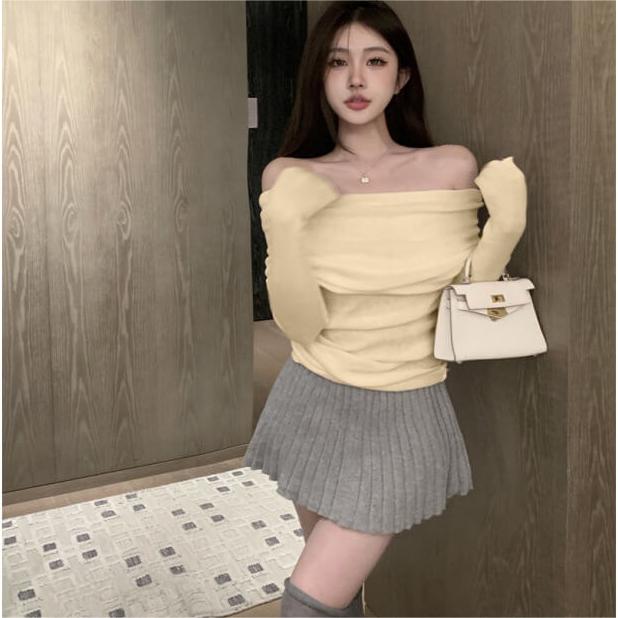 French one-shoulder collarbone-baring soft knit